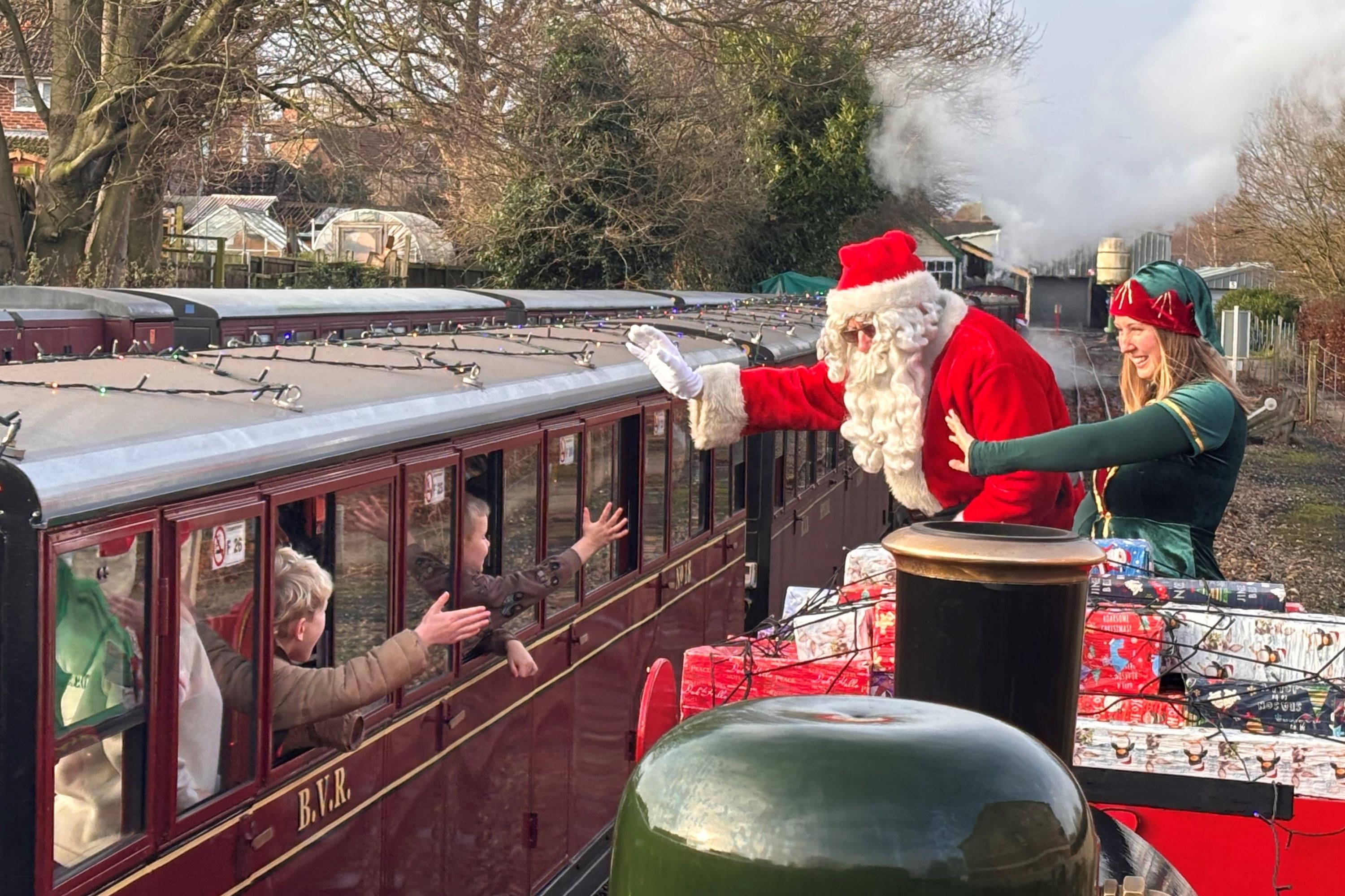 Father Christmas And His Elf Visiting For The Festive Express